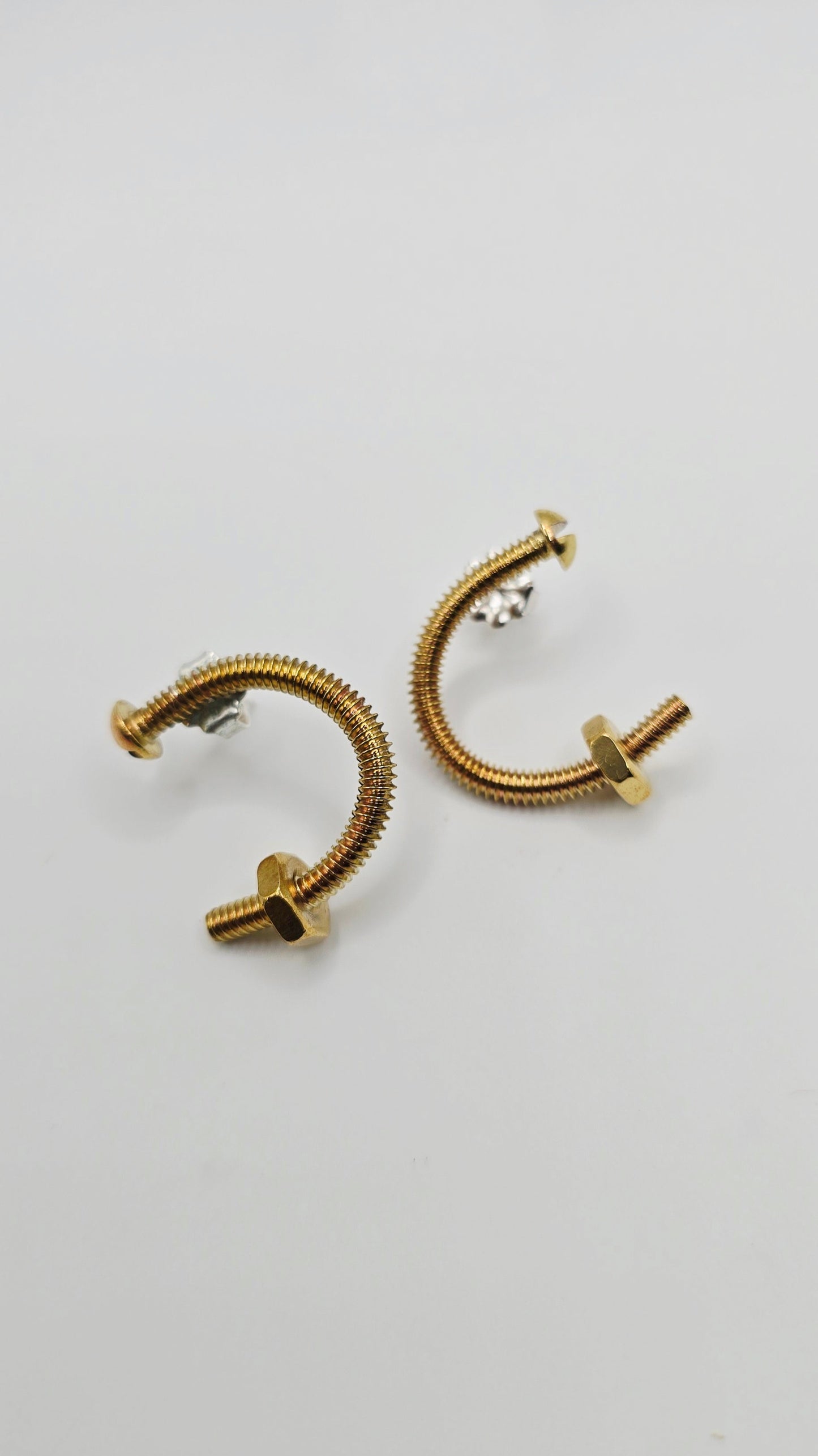 Unique brass screw earrings by Jill Melyssa with real nuts. Sterling silver ear posts
