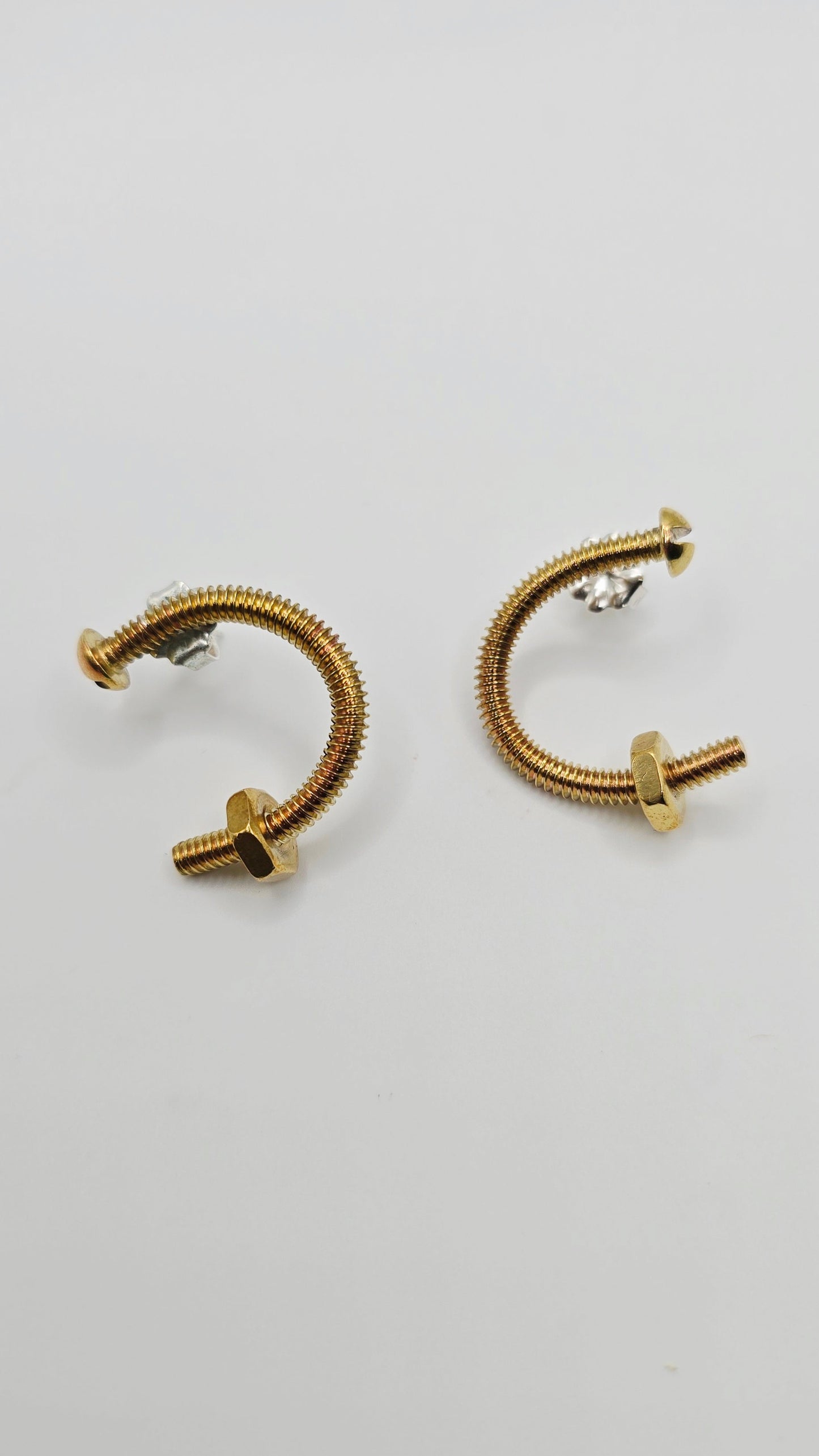 Unique brass screw earrings by Jill Melyssa with real nuts. Sterling silver ear posts