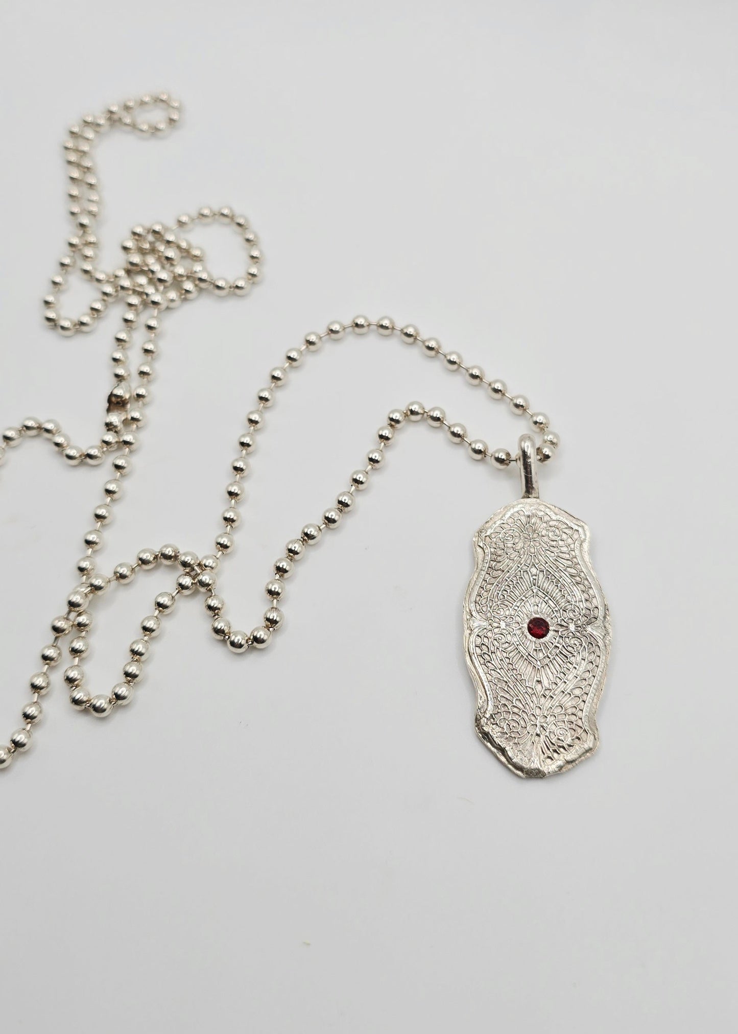 Ornate Garnet Necklace in Sterling Silver