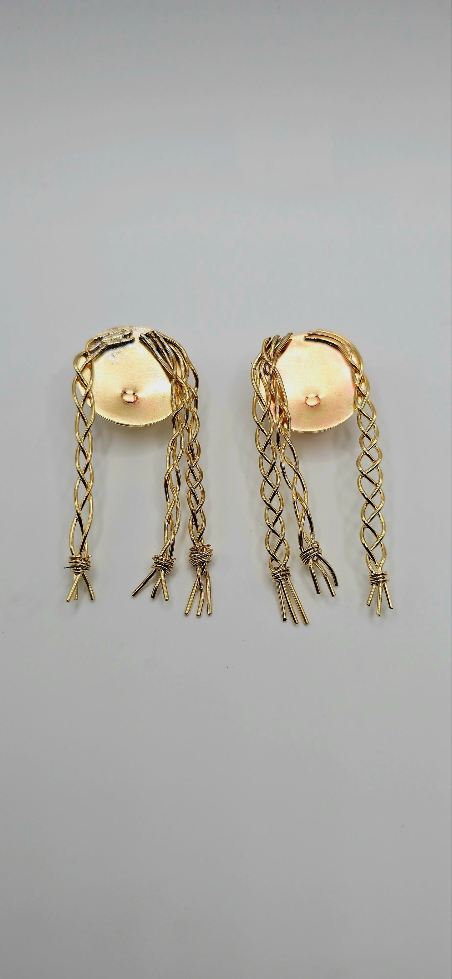 Pair of gold brass earrings of a little girl with braids by Jill Melyssa