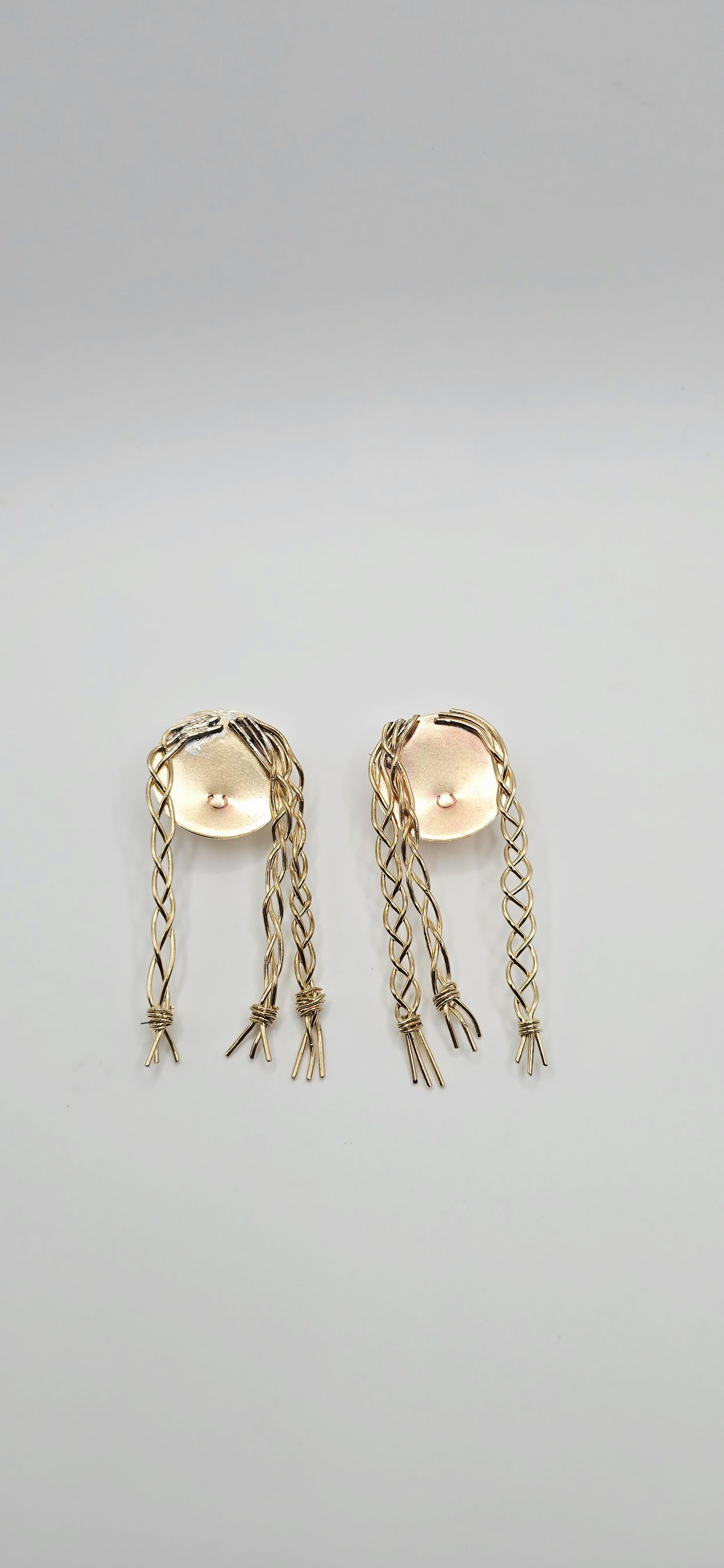 Pair of gold brass earrings of a little girl with braids by Jill Melyssa