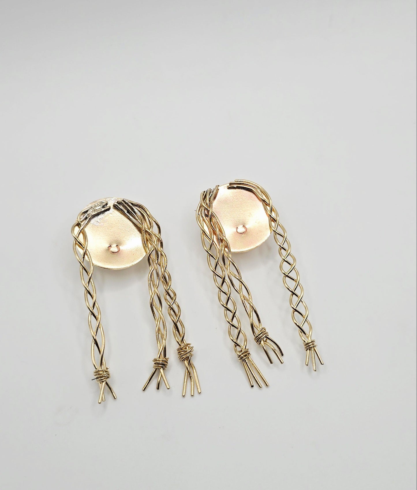 Pair of gold brass earrings of a little girl with braids by Jill Melyssa