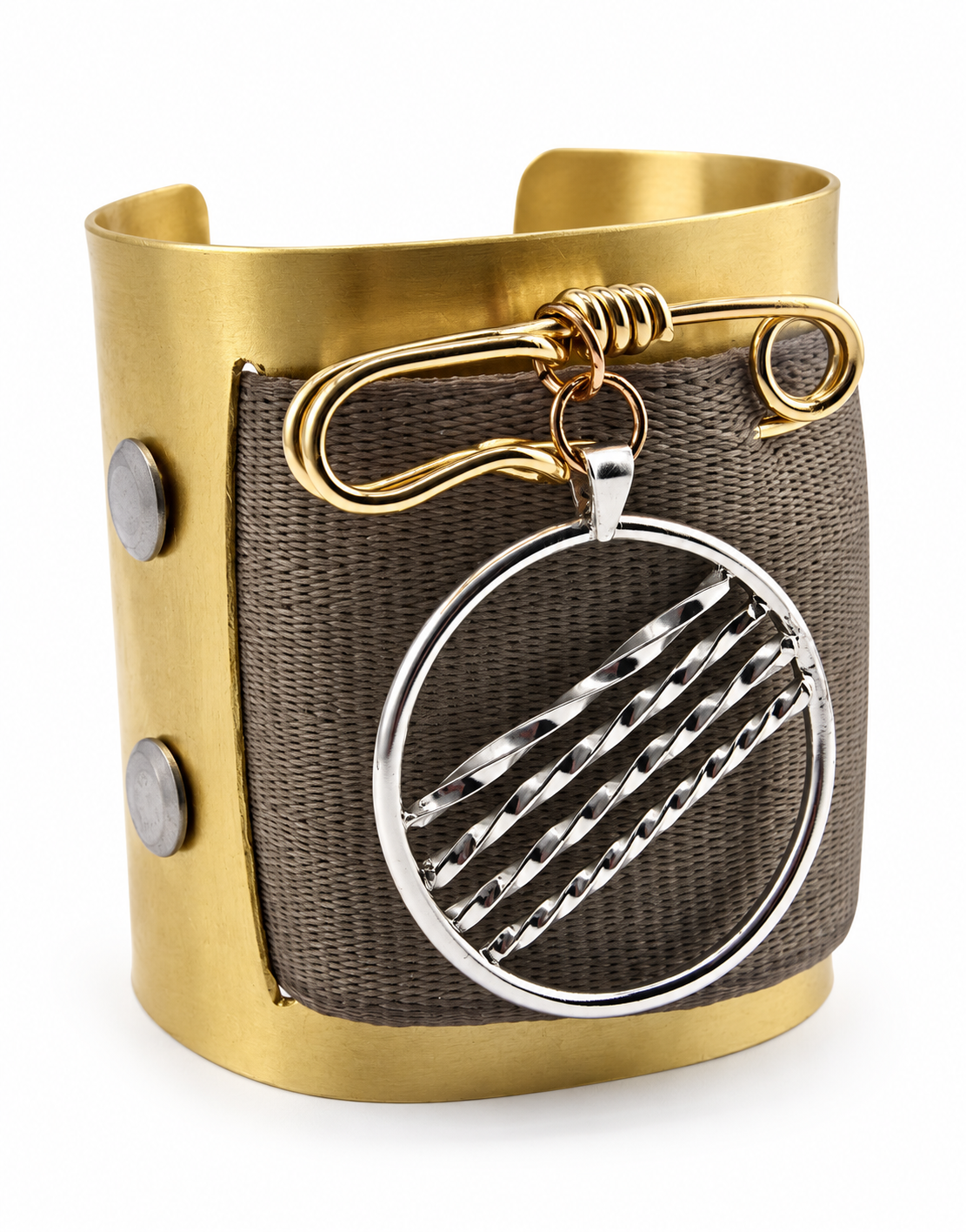 Brass cuff bracelet featuring a woven seat belt material panel, handcrafted brass safety pin, and removable sterling silver pendant with diagonal textured lines.