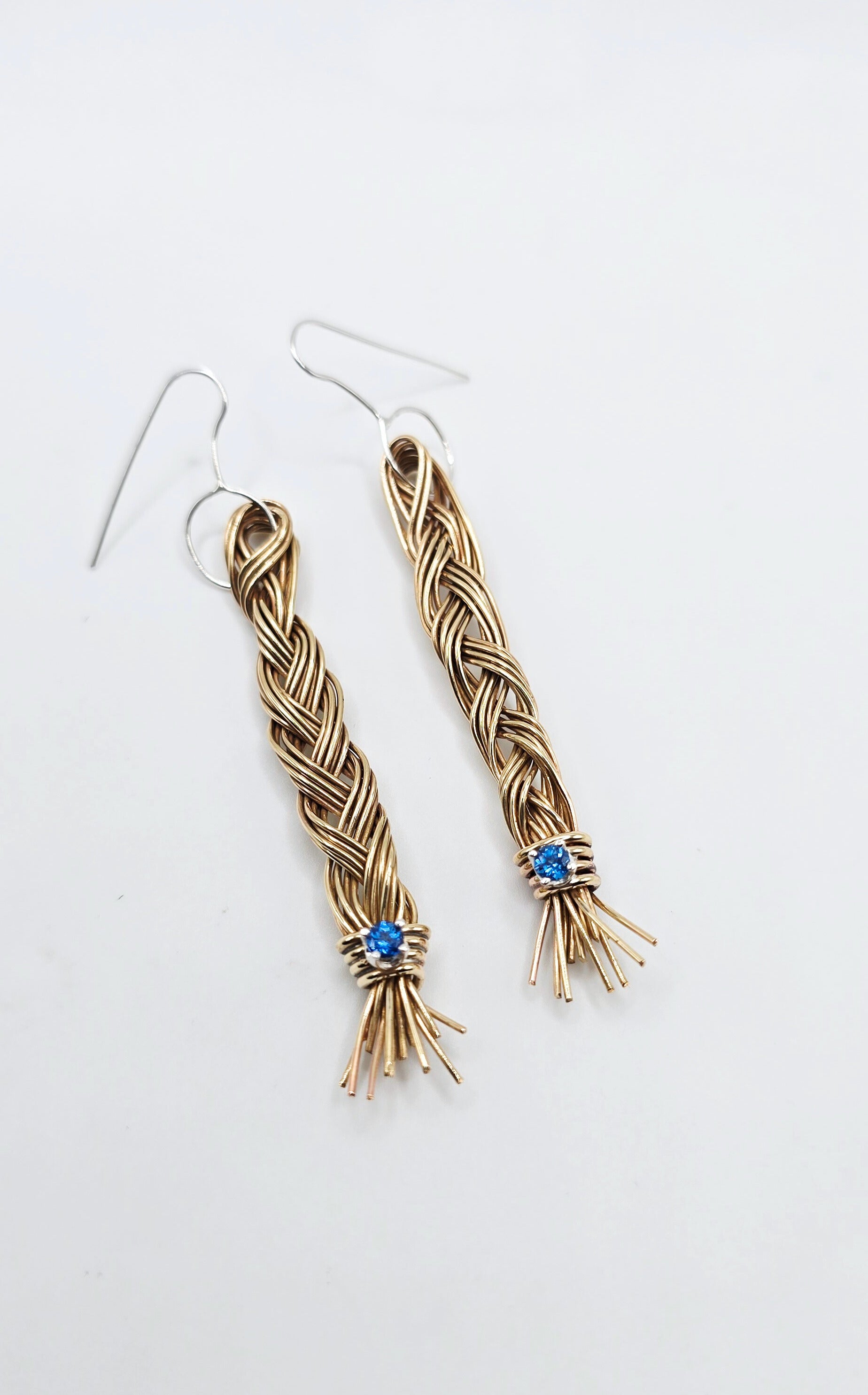 Braided brass dangled earrings with london blue topaz