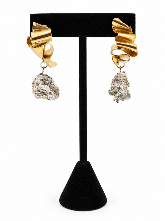 Duality sculptural earrings featuring polished brass forms, textured sterling silver pendants, and 3mm cubic zirconia stones, from Jill Melyssa’s Two Truths Collection.