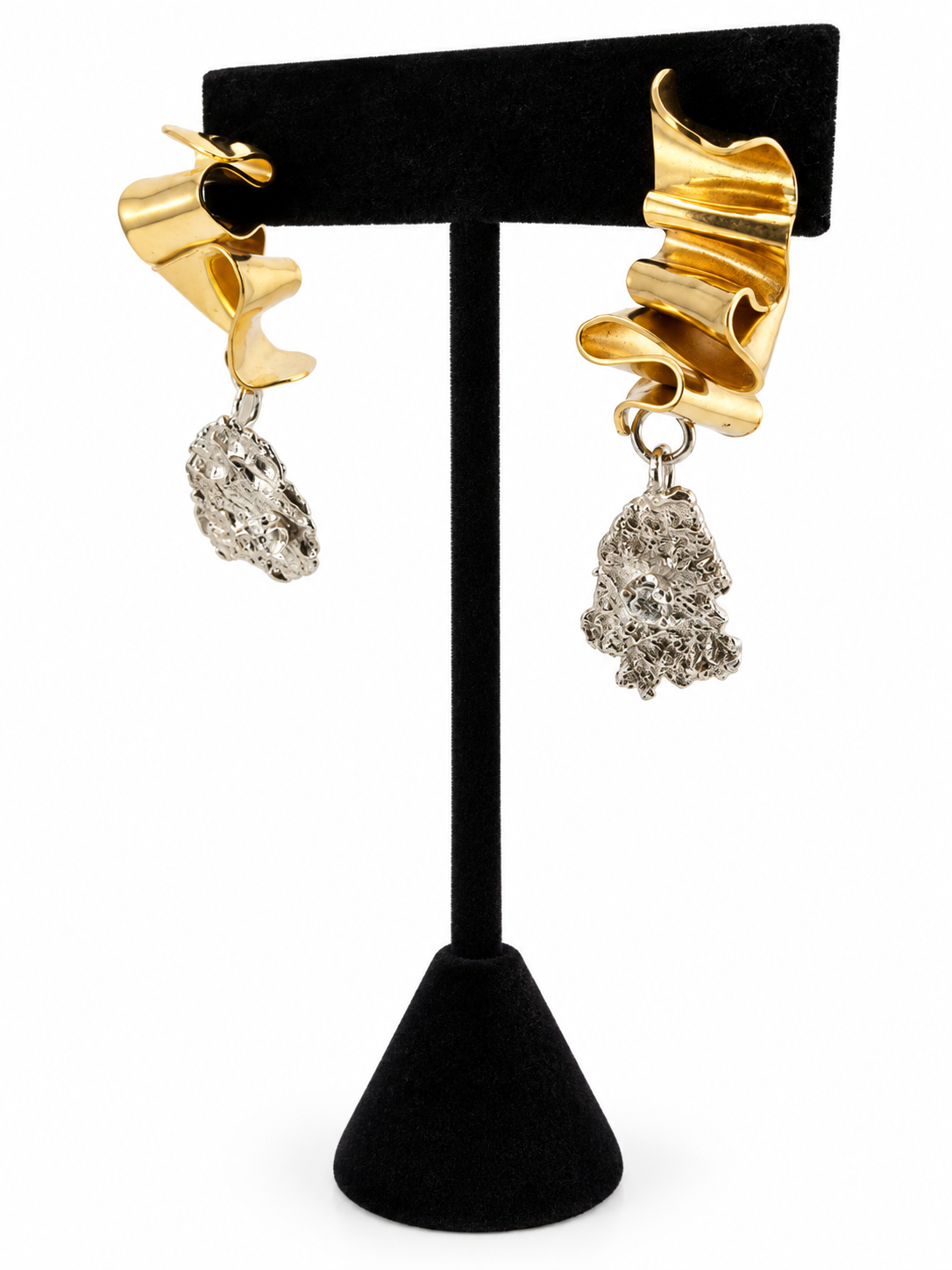 Side view of Duality sculptural sterling silver and brass earrings with irregular silver pendants and sparkling 3mm cubic zirconia details.