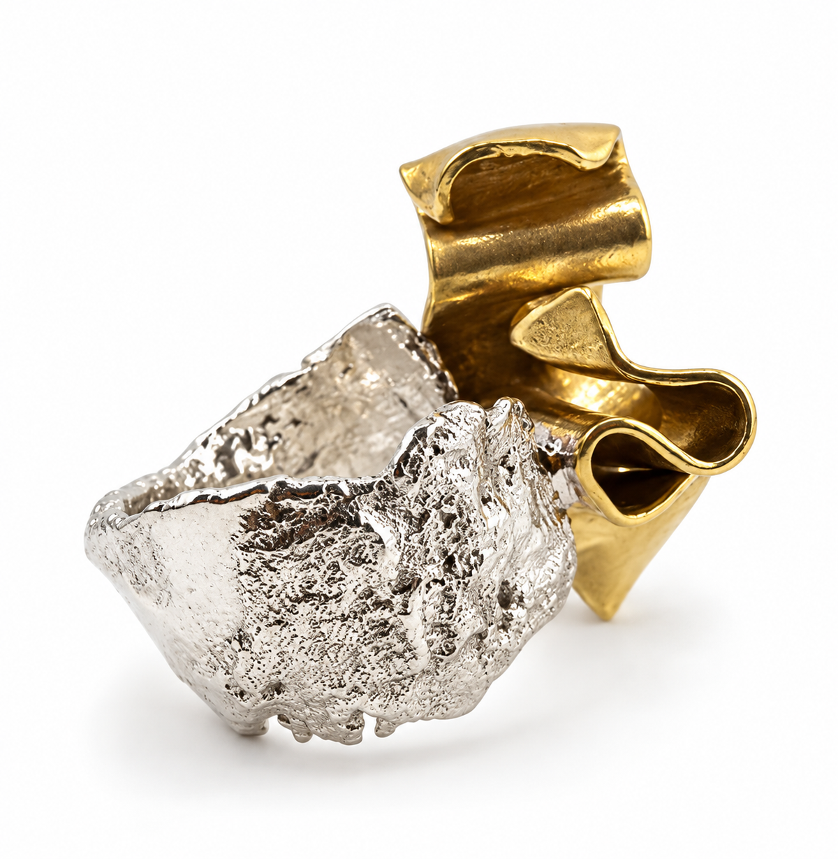 Duality one of a kind sculptural ring in sterling silver and brass, showcasing contrasting textures and forms that represent two truths existing at once.