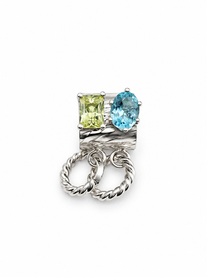 Sculptural sterling silver ear cuff featuring an oval blue apatite and rectangular lemon quartz gemstones, with removable twisted silver hoops, from Jill Melyssa’s Elemental Collection.