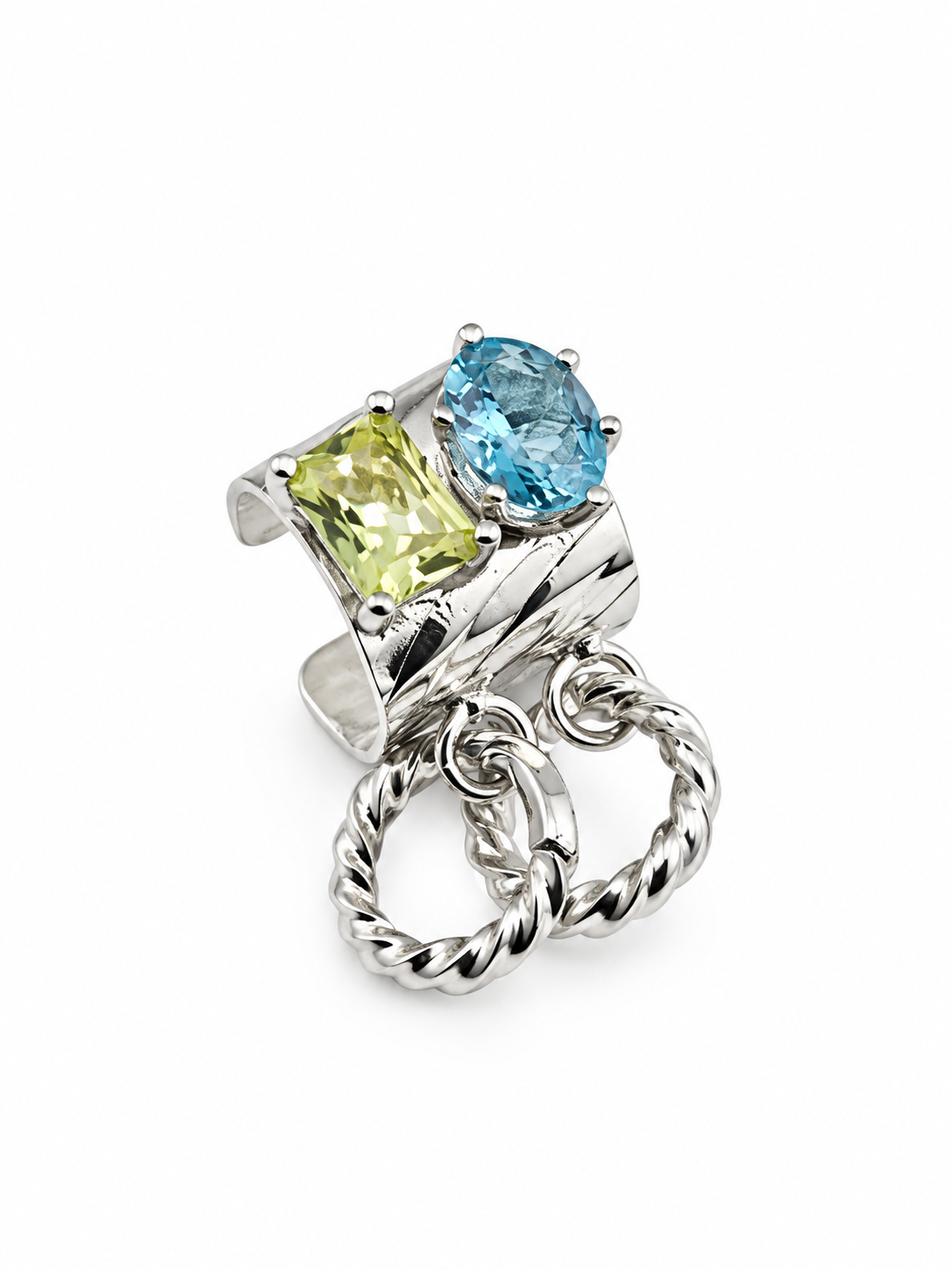 Close up of the sterling silver gemstone ear cuff showing the 8 × 4 mm oval apatite, 7 × 5 mm rectangular lemon quartz, and removable silver hoops.