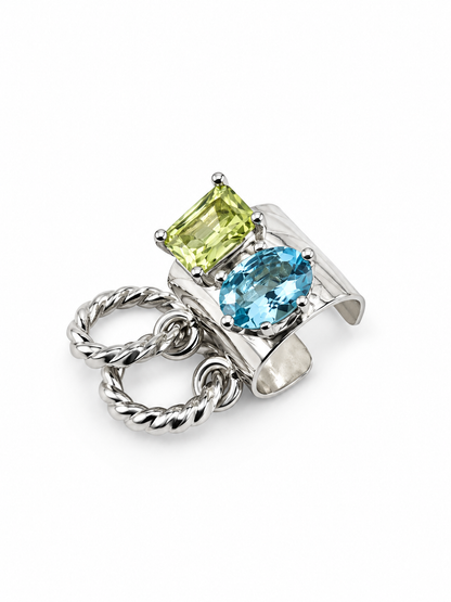 Angled view of Jill Melyssa’s sculptural gemstone ear cuff in sterling silver, highlighting the textured cuff, contrasting apatite and lemon quartz, and removable hoops.