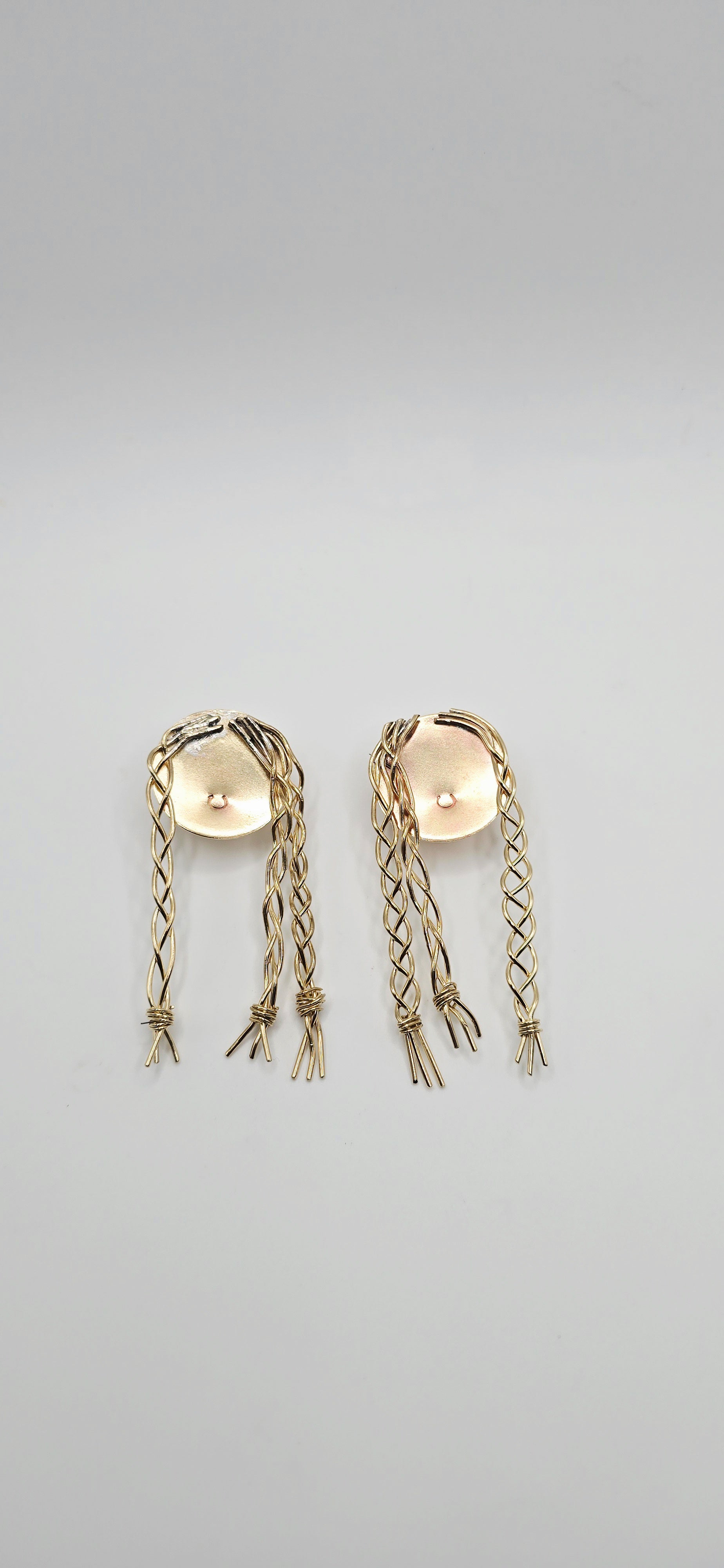 Pair of gold brass earrings of a little girl with braids by Jill Melyssa