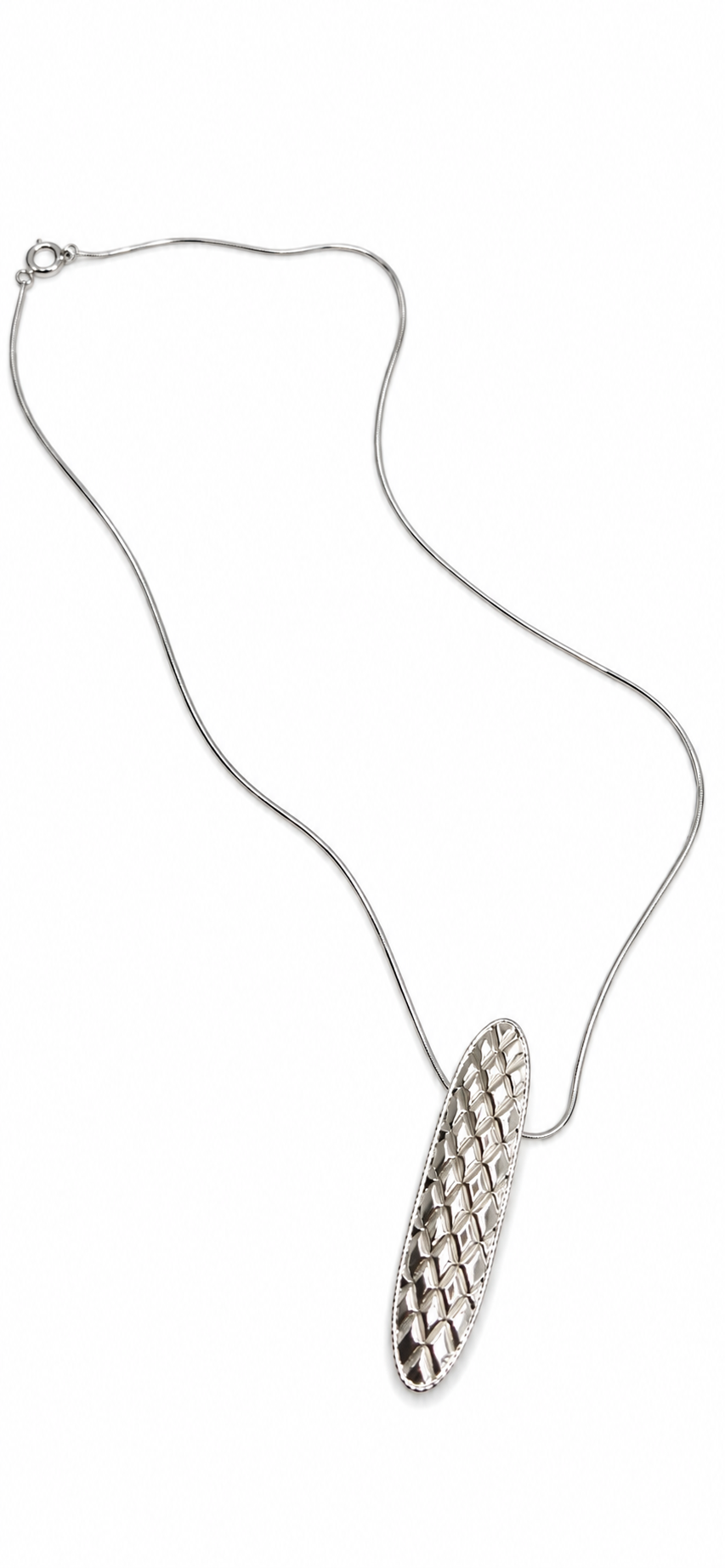 Quilted sterling silver necklace displayed on a white jewelry bust, featuring an elongated oval pendant with a raised geometric quilted texture, from Jill Melyssa’s Debut Collection.