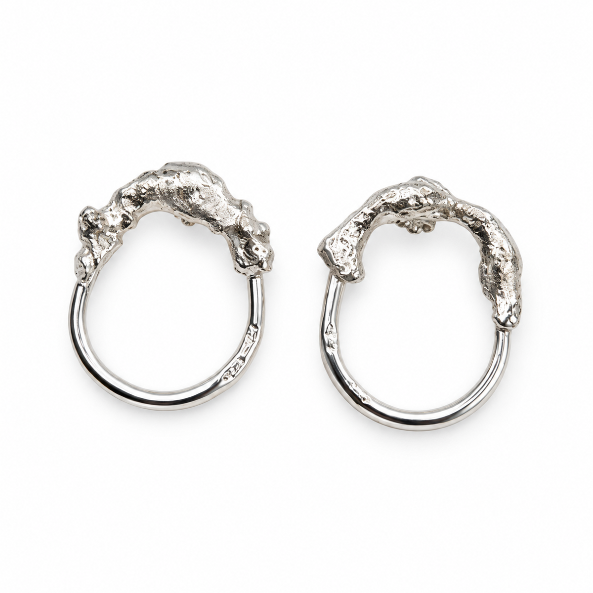 Melted and Modern sterling silver earrings featuring organic, textured molten forms paired with smooth circular hoops, from Jill Melyssa’s Two Truths collection.
