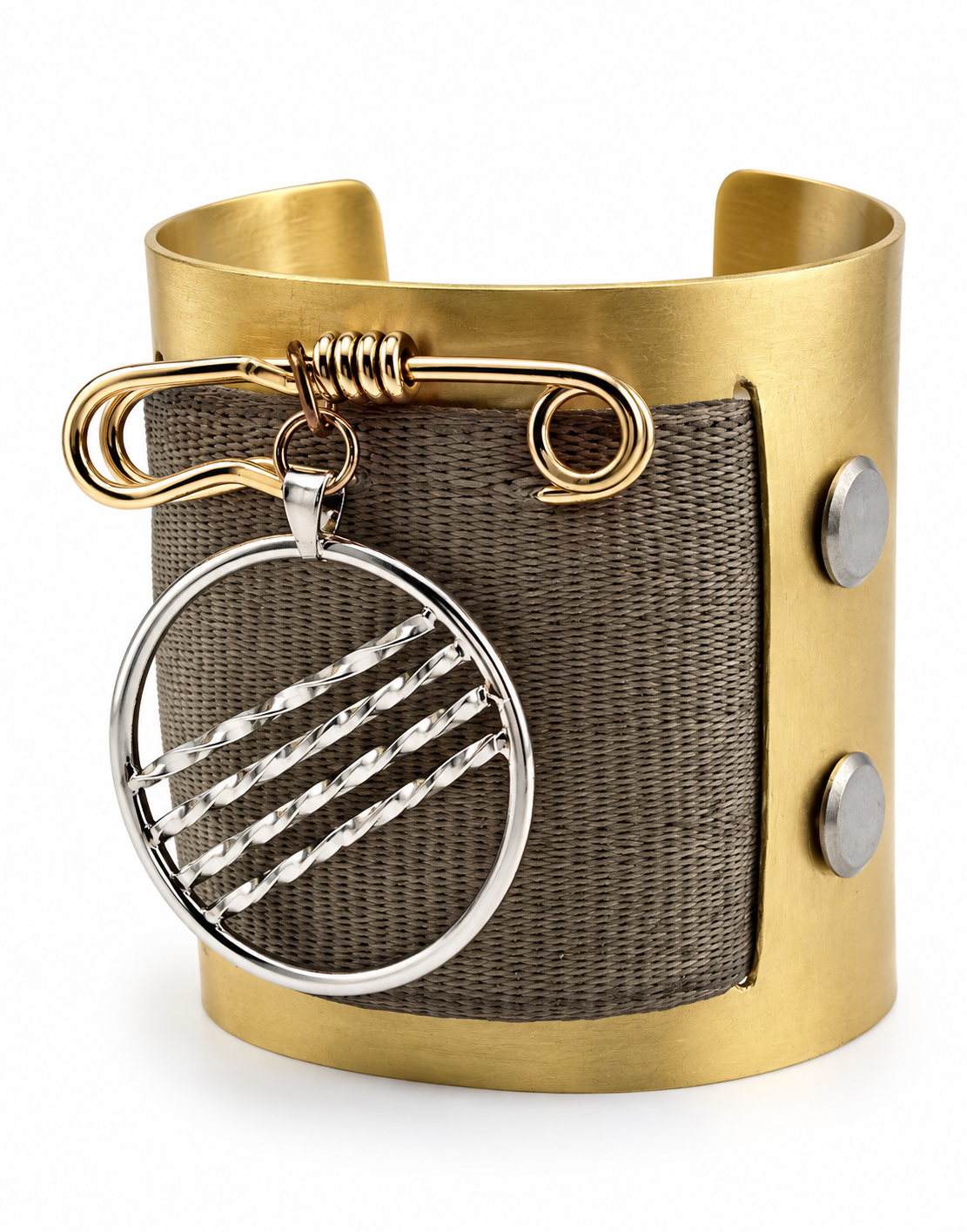 Side view of a sculptural brass cuff with woven seat belt material, brass safety pin detail, and removable sterling silver pendant hanging from the front.